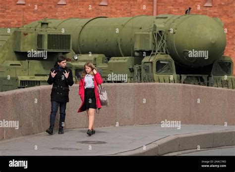 A Couple Passes By A Russian Intercontinental Ballistic Missile Topol