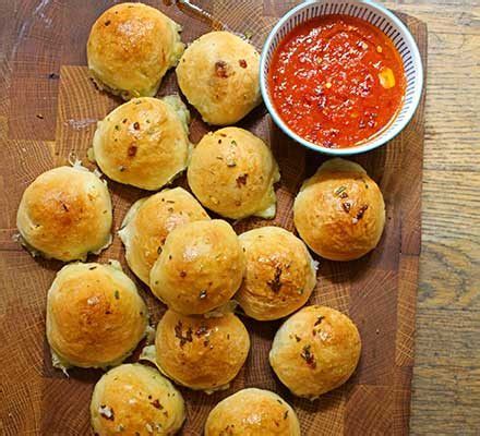 Cheese Stuffed Garlic Dough Balls With A Tomato Sauce Dip